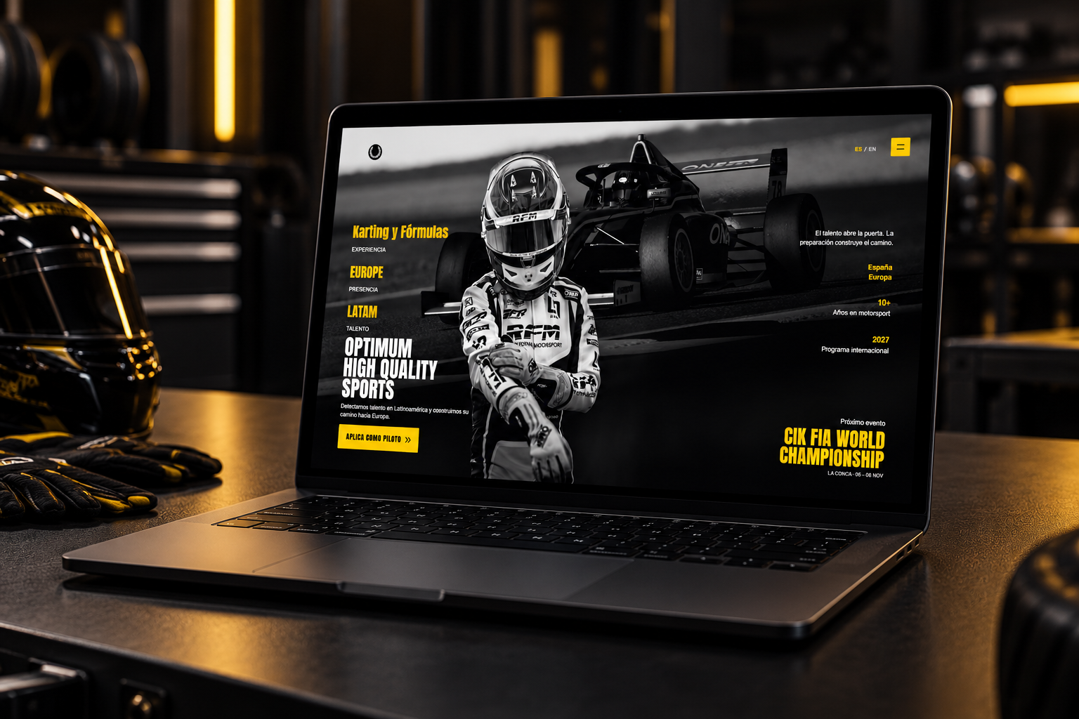Optimum High Quality Sports website presented on a laptop in a motorsport studio
